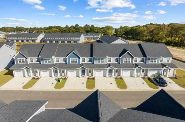 Townhouses with garages and driveways exterior at 11 at Main in Winterville Student Accommodation
