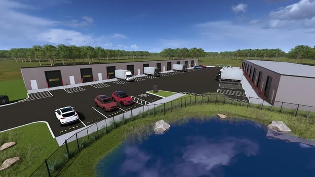 Storage units with loading docks cars pond exterior at 11 at Main in Winterville Student Accommodation