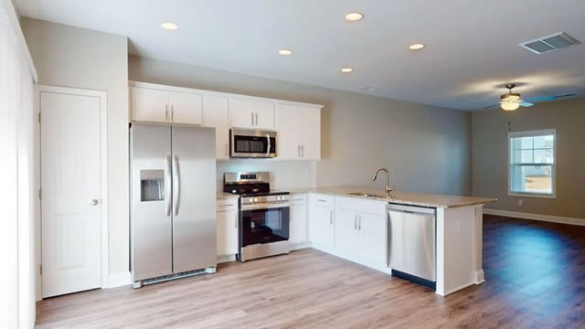 Refrigerator stove microwave dishwasher cabinets kitchen at 11 at Main in Winterville Student Accommodation