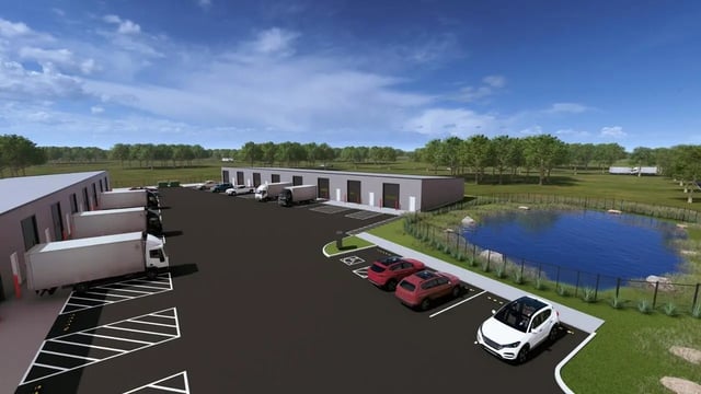 Warehouses with loading docks and parking lot exterior at 11 at Main in Winterville Student Accommodation