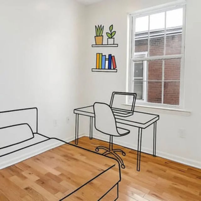 Bed desk chair shelves laptop plants books bedroom at Art Sharm Living in Philadelphia Student Accommodation