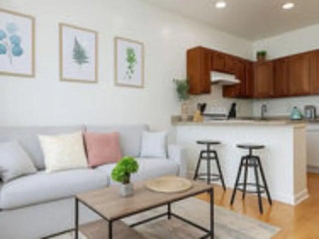 Sofa kitchen bar stools living room at Art Sharm Living in Philadelphia Student Accommodation