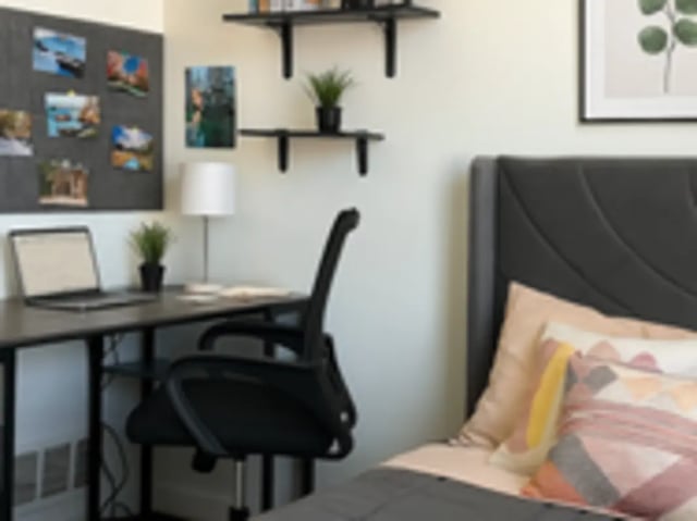 Desk chair laptop photos and bed bedroom at Art Sharm Living in Philadelphia Student Accommodation