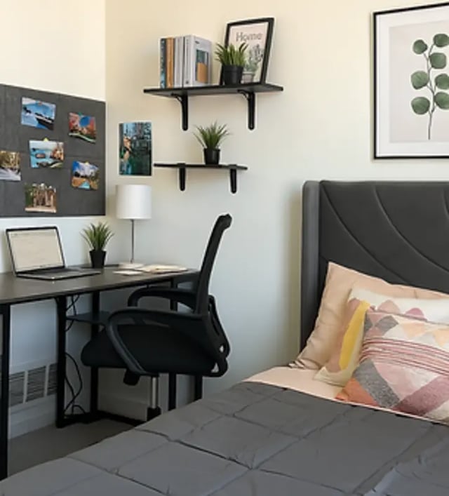 Desk laptop chair bed with pillows bedroom at Art Sharm Living in Philadelphia Student Accommodation