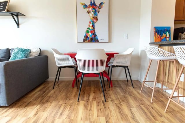Dining table with chairs and sofa living area at 494 Lofts in Boone Student Accommodation