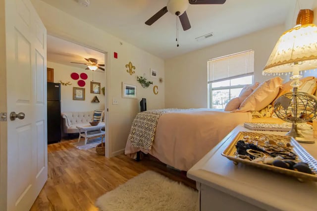 Bed pillows blanket and lamp bedroom at 494 Lofts in Boone Student Accommodation