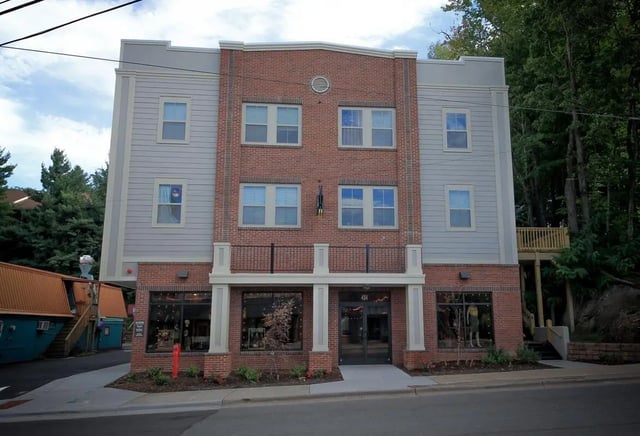 Apartment building with brick and siding exterior exterior at 494 Lofts in Boone Student Accommodation