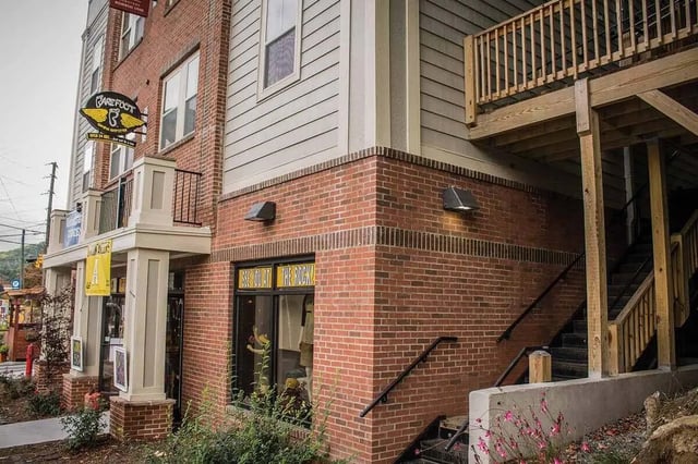 Brick building with windows stairs and balcony exterior at 494 Lofts in Boone Student Accommodation