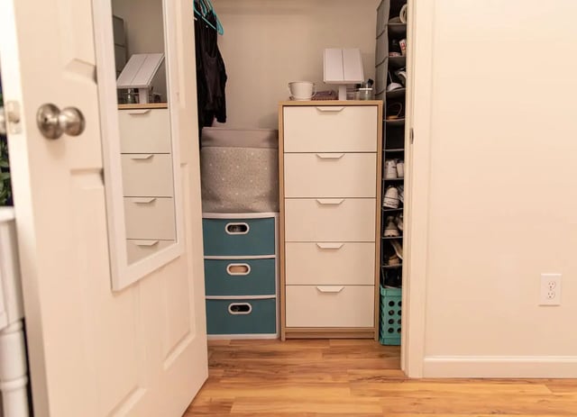 Closet with drawers storage bins and shoes storage closet at 494 Lofts in Boone Student Accommodation