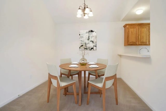 Round dining table with four chairs dining area at Beau Chene Condominiums, Inc in Baton Rouge Student Accommodation