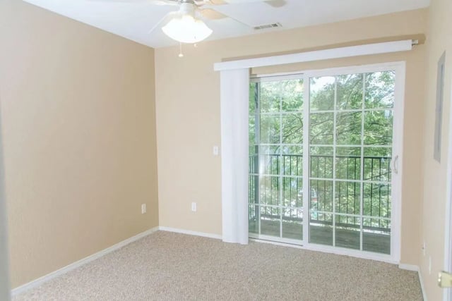 Empty room with carpet ceiling fan and balcony bedroom at Campus Crossing Apartments in Greensboro Student Accommodation