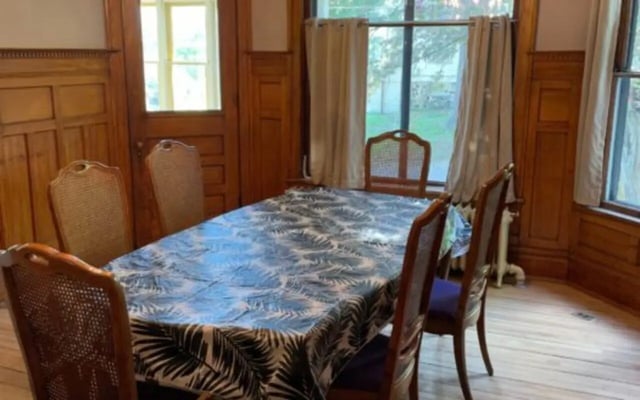 Dining table with chairs wooden paneling dining area at Copper Country Rentals in Houghton Student Accommodation