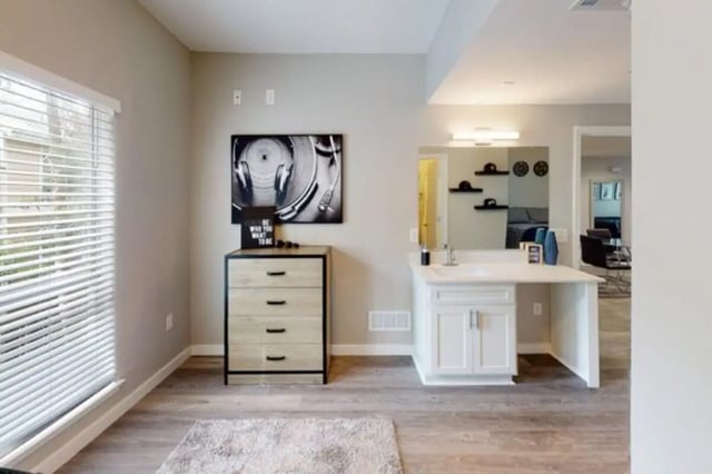 Dresser sink with mirror and window study area at Altura Student Living in Tallahassee Student Accommodation
