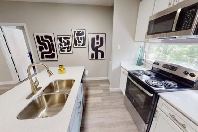 Island sink stove microwave modern art kitchen at Altura Student Living in Tallahassee Student Accommodation