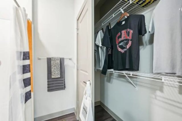 Towels on rack closet with shirts storage area at Catalyst in Atlanta Student Accommodation