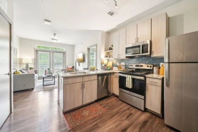 Modern kitchen with stainless steel appliances and island kitchen at Catalyst in Atlanta Student Accommodation