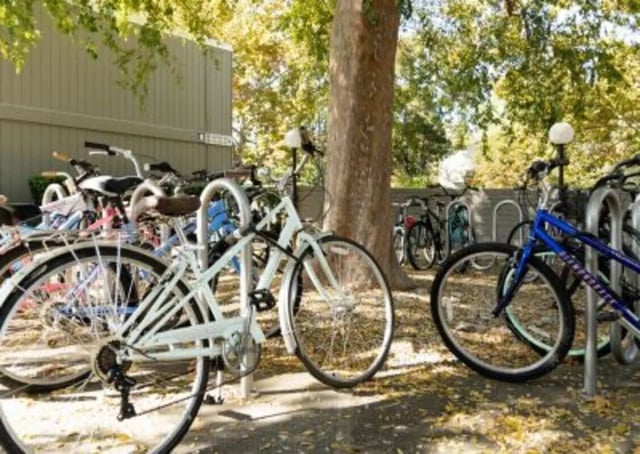 Bikes parked on racks exterior exterior at Aggie Square Apartments in Davis Student Accommodation