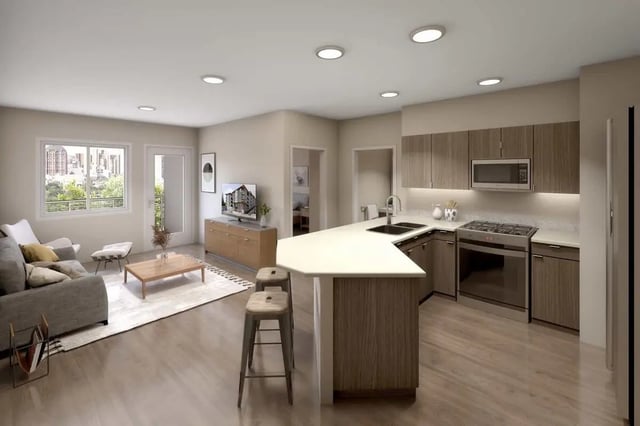Sofa coffee table kitchen island living room kitchen at 500 Square Apartments in Bellingham Student Accommodation
