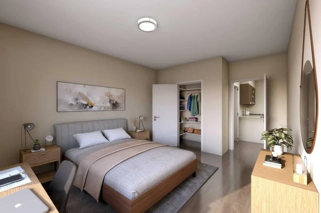 Bed desk closet and small kitchen view bedroom at 500 Square Apartments in Bellingham Student Accommodation