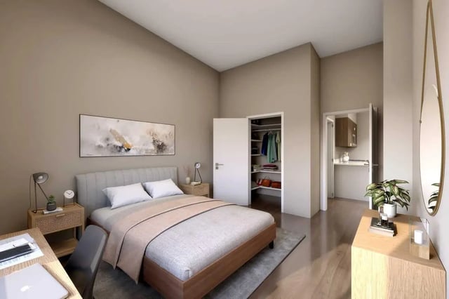 Bed closet desk and kitchenette bedroom at 500 Square Apartments in Bellingham Student Accommodation