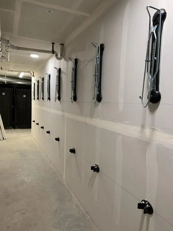 Wall mounted bike racks in a hallway storage. at 500 Square Apartments in Bellingham Student Accommodation