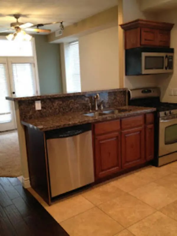 Granite countertop dishwasher sink cabinets microwave kitchen at City Creek Manor in Salt Lake City Student Accommodation