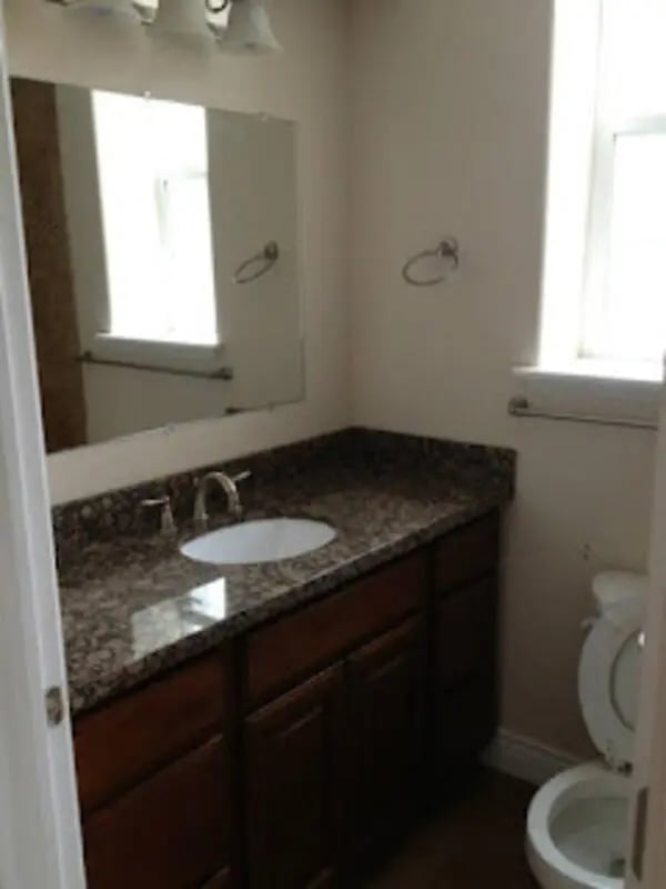 Granite vanity sink and toilet bathroom at City Creek Manor in Salt Lake City Student Accommodation