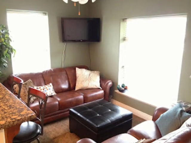 Leather sofa ottoman TV living room at City Creek Manor in Salt Lake City Student Accommodation