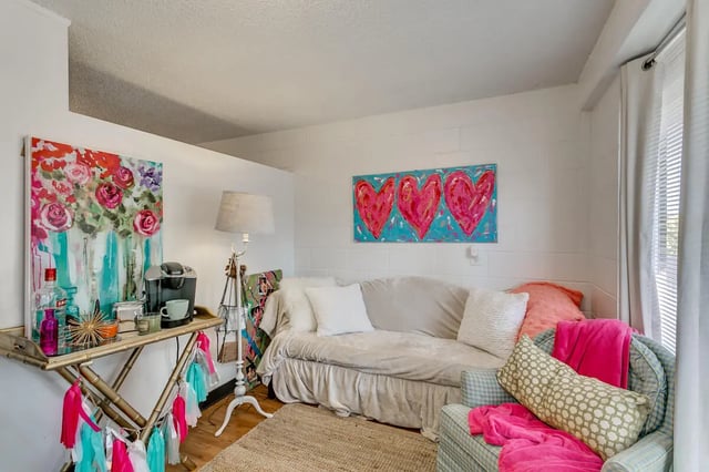 Sofa, art, coffee maker, chair living room at Cobblestone Court Apartments in Tuscaloosa Student Accommodation