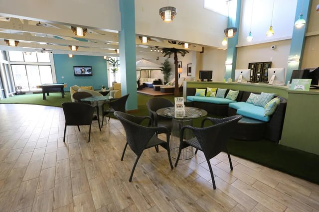 Seating area with couches and chairs communal area at Collegiate Communities in West Lafayette Student Accommodation