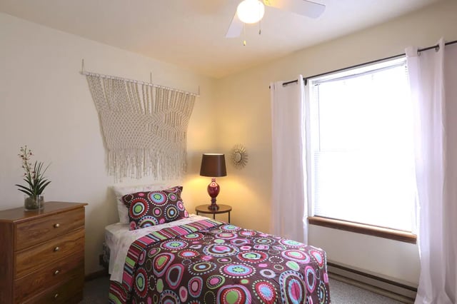Macrame wall hanging bed and dresser bedroom at Collegiate Communities in West Lafayette Student Accommodation