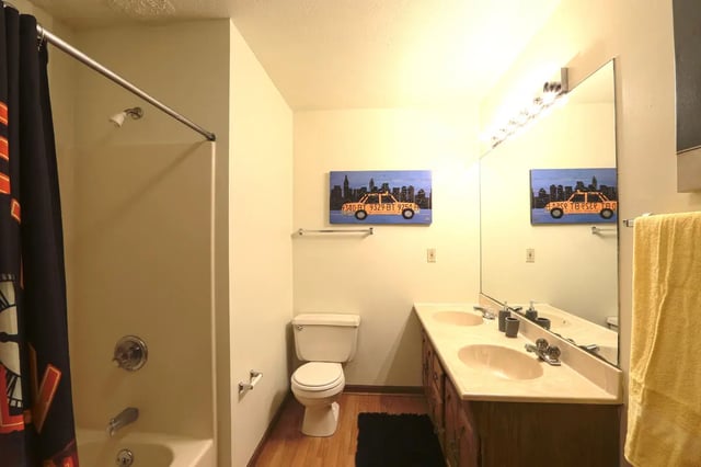 Shower toilet vanity with double sinks bathroom at Collegiate Communities in West Lafayette Student Accommodation