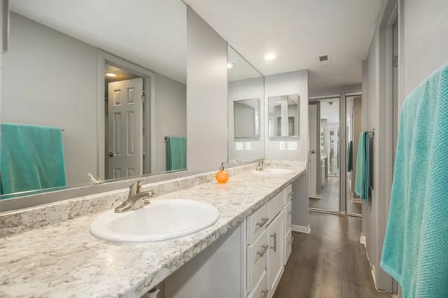 Double sink vanity grey cabinets and aqua towels bathroom at Campus Hill Apartments in Ithaca Student Accommodation