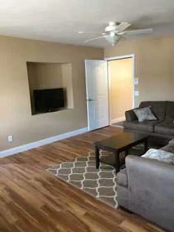 Sofa television rug and coffee table living room at Cornerstone Properties Cortland, LLC in Cortland Student Accommodation