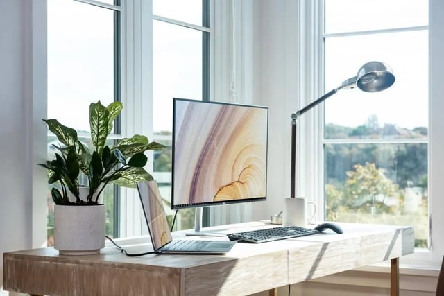 Desk with computer plant and lamp study area at Ashburn Hills Townhomes in Tallahassee Student Accommodation