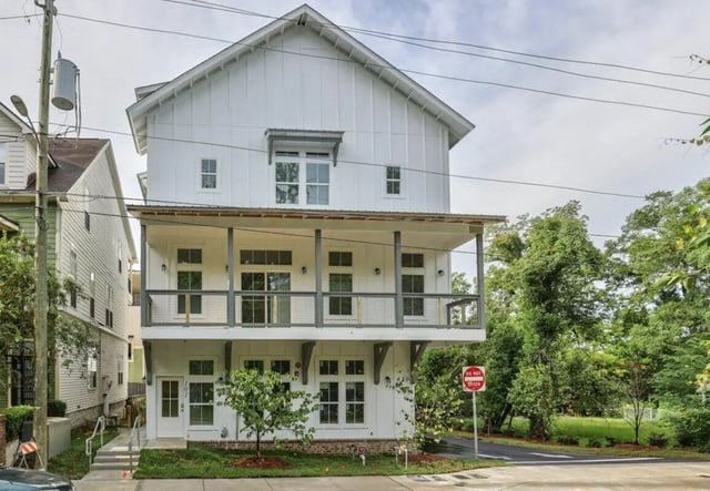 Modern white building balcony windows driveway exterior at Ashburn Hills Townhomes in Tallahassee Student Accommodation