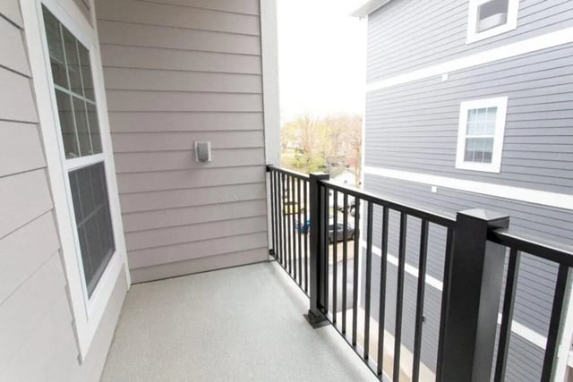 Balcony with railing and window exterior at 120 Flats in West Lafayette Student Accommodation
