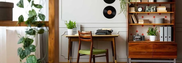 Desk with typewriter chair and bookshelf study area at Cedar Flats Apartments in Chico Student Accommodation