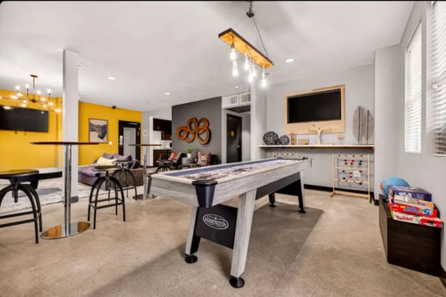 Pool table couch and games playing area at Cedar Flats Apartments in Chico Student Accommodation