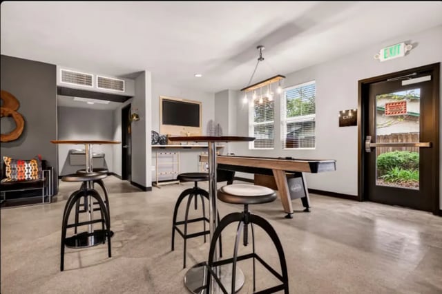 Pool table and stools in common room. at Cedar Flats Apartments in Chico Student Accommodation