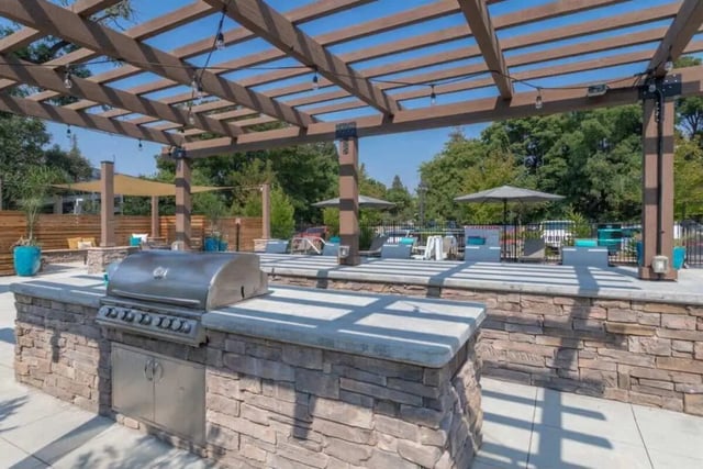Outdoor grill and seating area exterior at Cedar Flats Apartments in Chico Student Accommodation