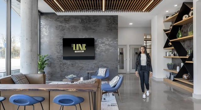 Lounge area with modern seating and bar seating living room at 525 Linc in Boston Student Accommodation