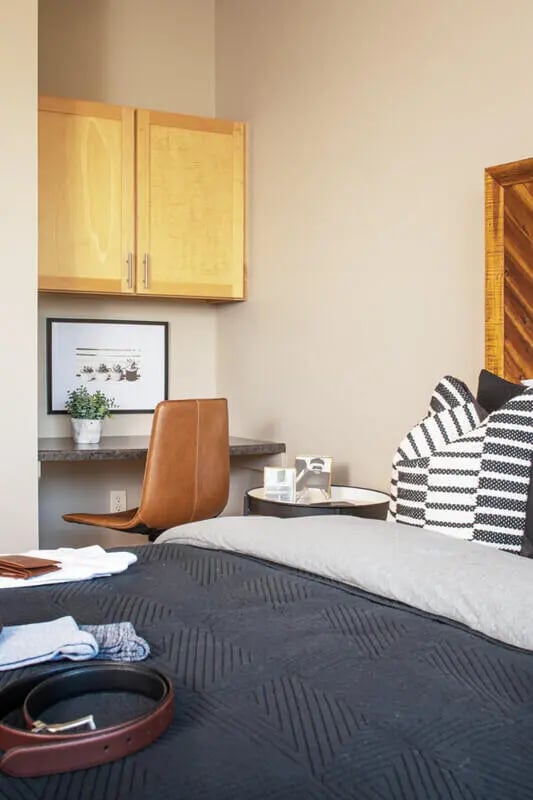 Bed desk and cabinets with pillows bedroom at Broadmoor Hills in Omaha Student Accommodation