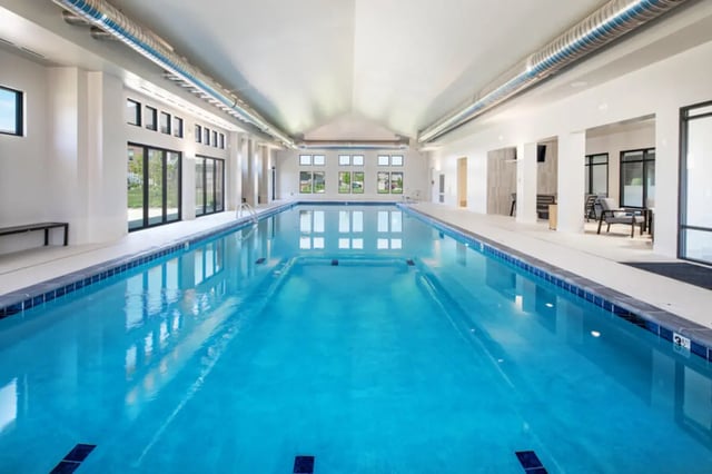 Indoor swimming pool with lounge area swimming pool at Broadmoor Hills in Omaha Student Accommodation