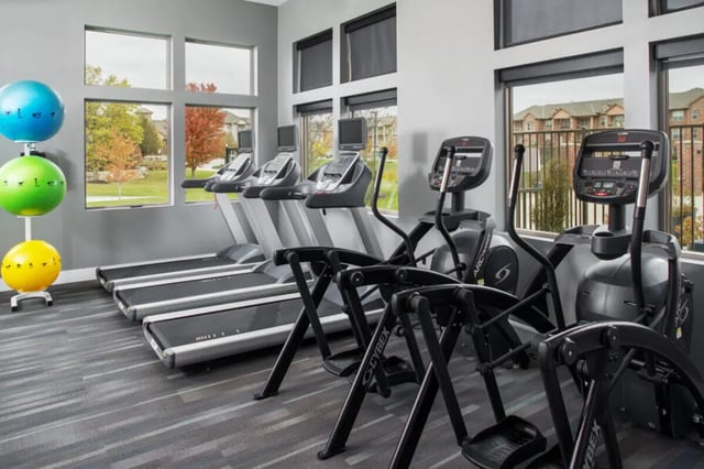 Treadmills ellipticals and exercise balls fitness area at Broadmoor Hills in Omaha Student Accommodation