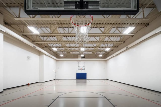 Basketball court with hoop and lines playing area at Broadmoor Hills in Omaha Student Accommodation