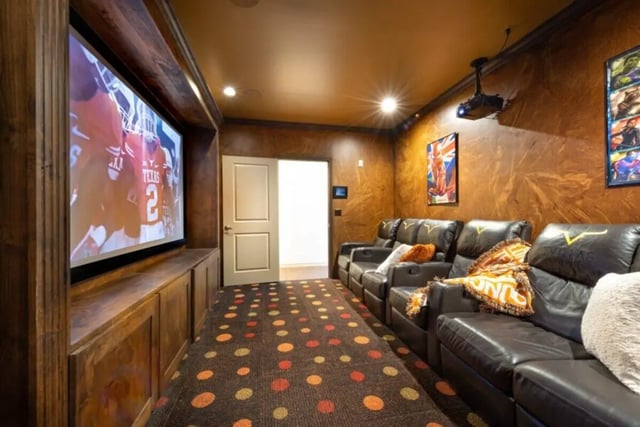 Theater room with large screen leather recliners living room at Villas on 26th in Austin Student Accommodation