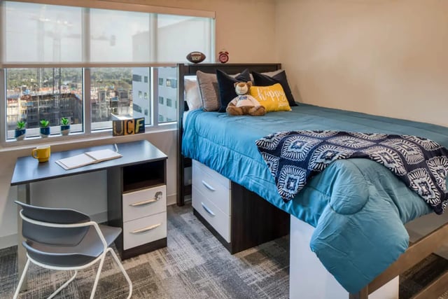 Bed desk chair with window view bedroom at UnionWest Student Living in Orlando Student Accommodation