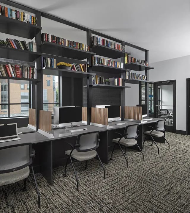 Computers and bookshelves study area at Vic Village North in Ann Arbor Student Accommodation