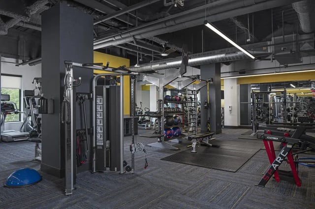 Gym equipment weight machines and exercise balls playing area at Vic Village North in Ann Arbor Student Accommodation